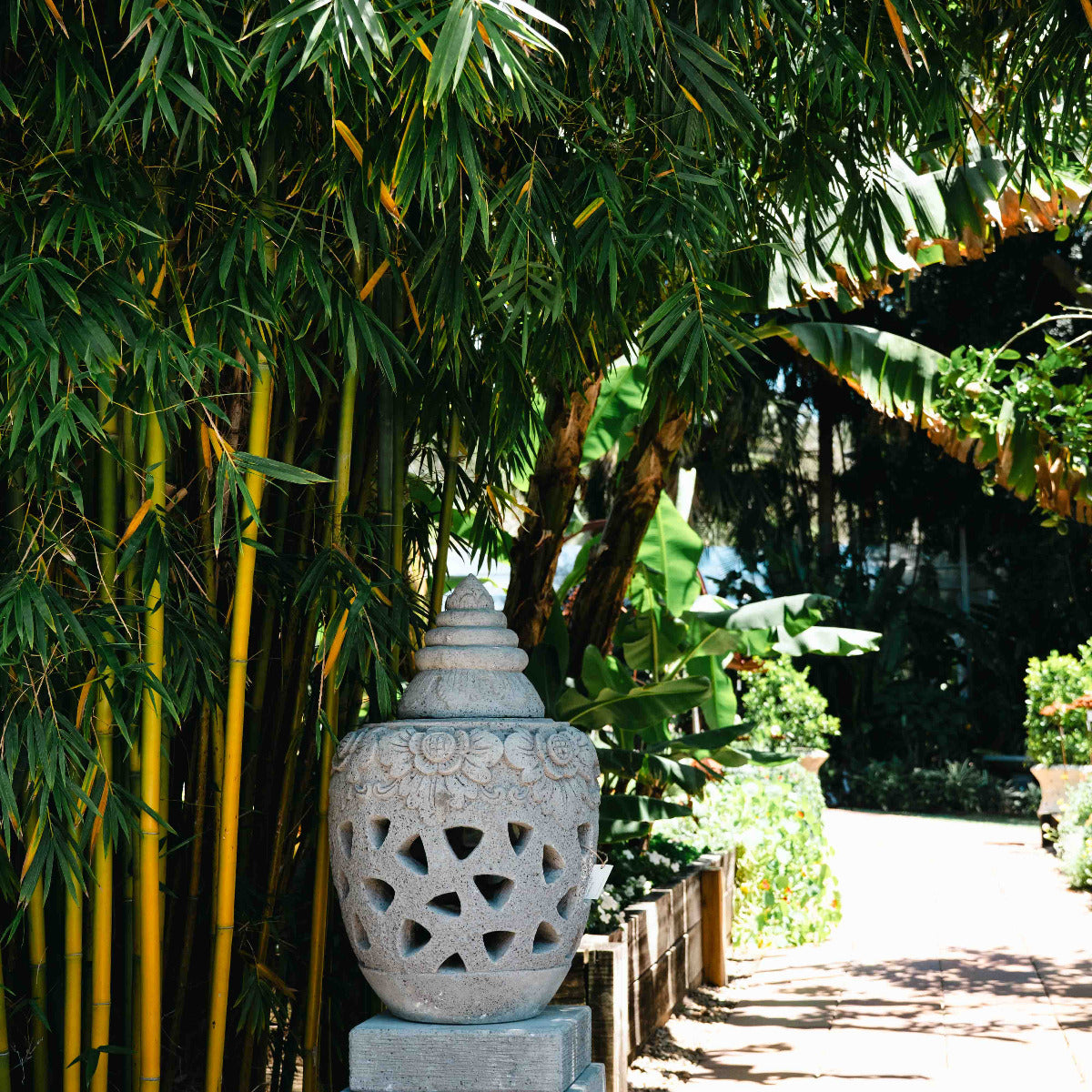 Stone lantern in a garden setting with bamboo and trees