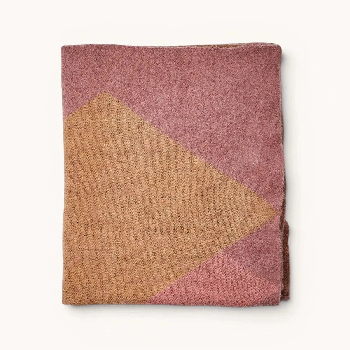 Wrap yourself in understated luxury with the Bonnie and Neil Geometric Pink Mohair Throw. Featuring a soft mohair blend and modern colour-block design, it's the perfect finishing touch for beds, sofas and cosy living spaces.
