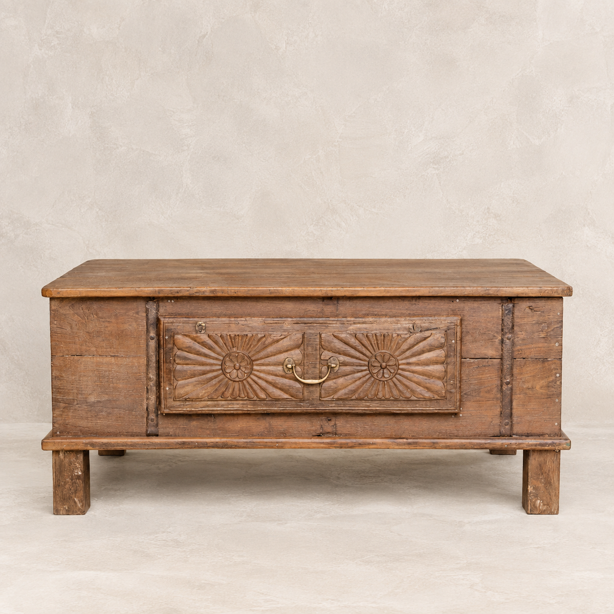 Vintage carved wooden coffee table from India with floral sunburst detailing and aged timber, 106 × 57 × 45cm, exclusive to Brookfield Gardens.
