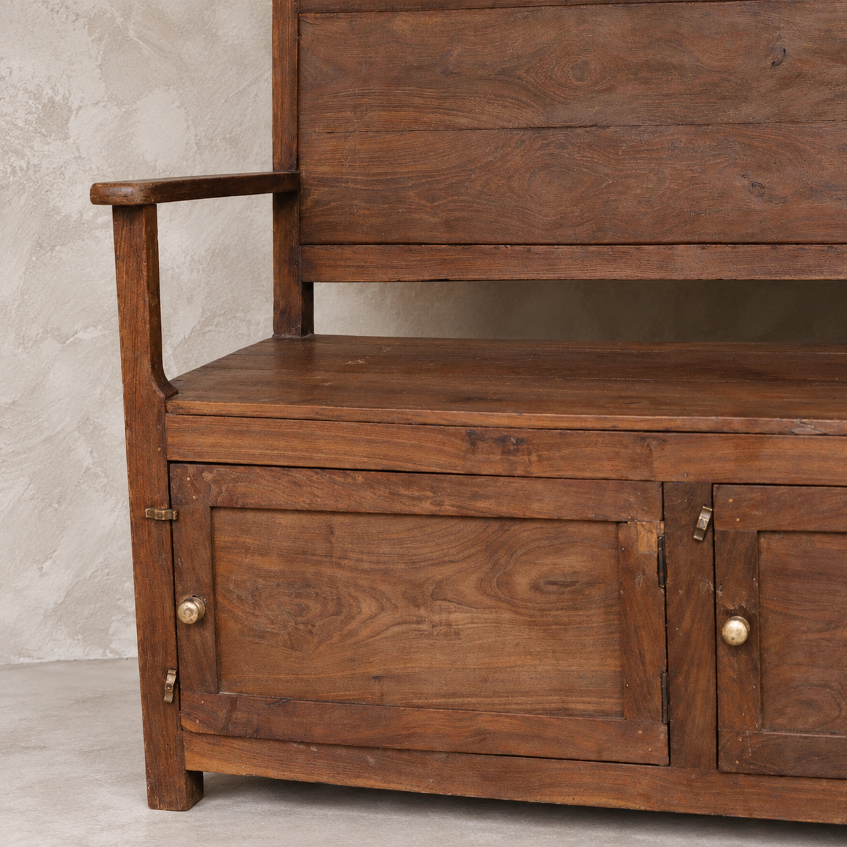 Vintage Indian wooden bench with three-door storage cupboard and naturally aged timber finish, exclusive to Brookfield Gardens Brisbane.