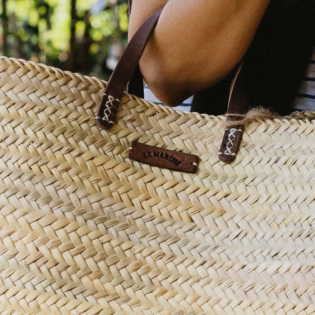 Oversized Le Marché Basket handmade in Morocco from premium palm leaf with genuine leather handles, available at Brookfield Gardens Brisbane.