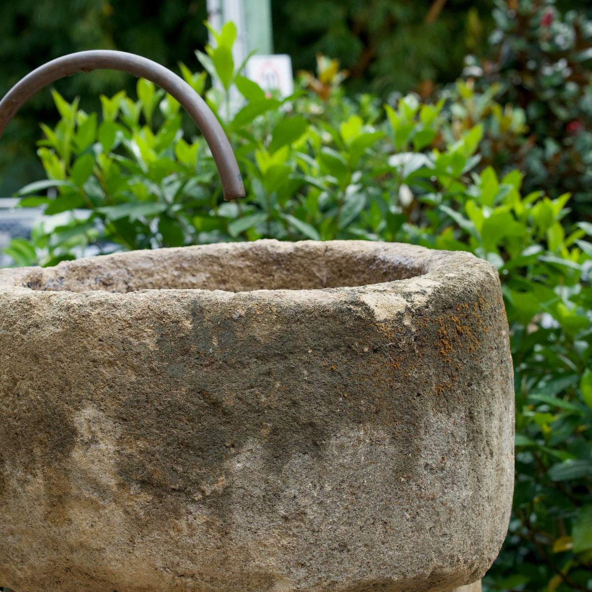 Limestone Pot Round Fountain with aged stone-look texture displayed in garden setting at Brookfield Gardens Brisbane