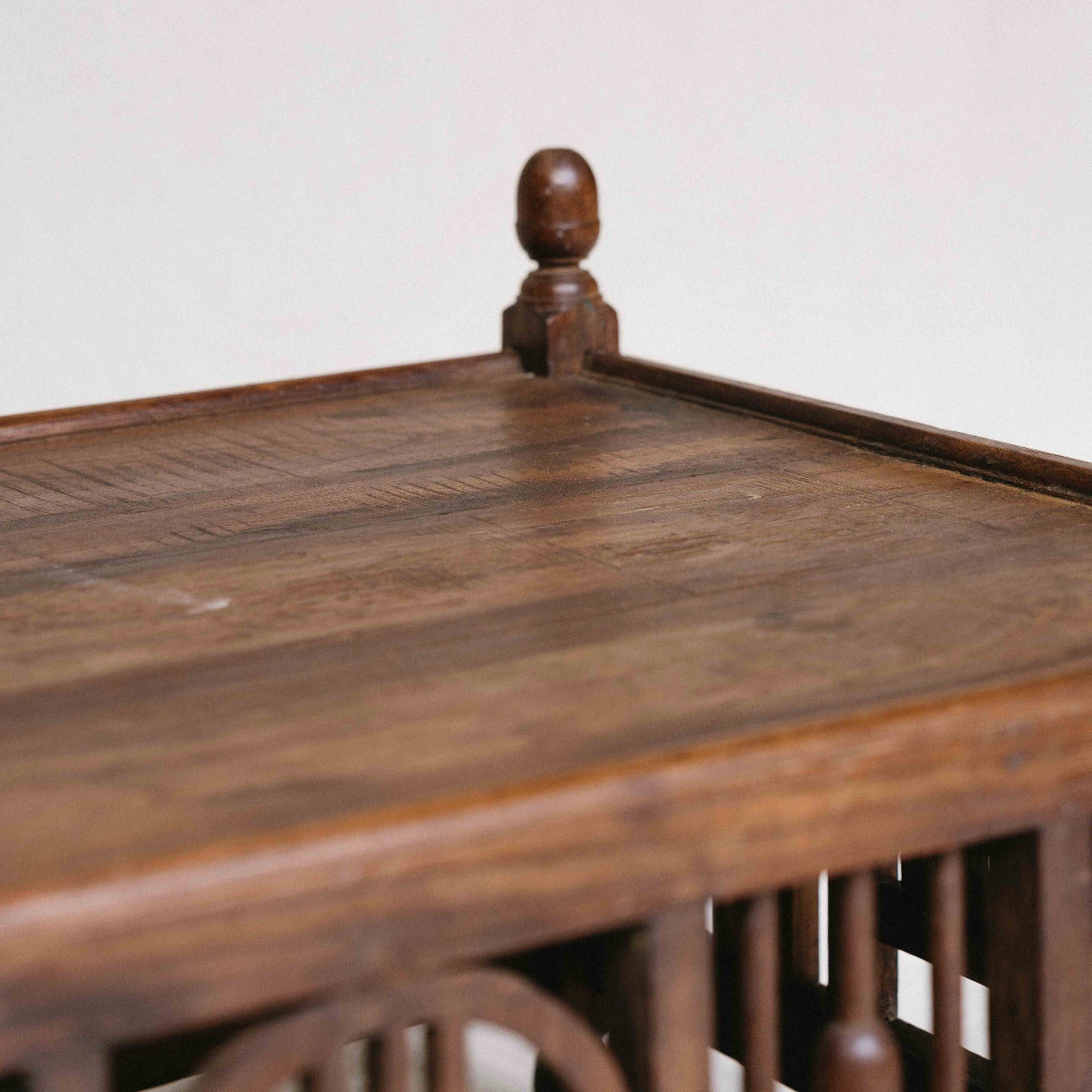 Vintage ornate wooden coffee table from India, 85 x 56 x 43cm, with carved panels, turned details and aged timber, exclusive to Brookfield Gardens Brisbane.