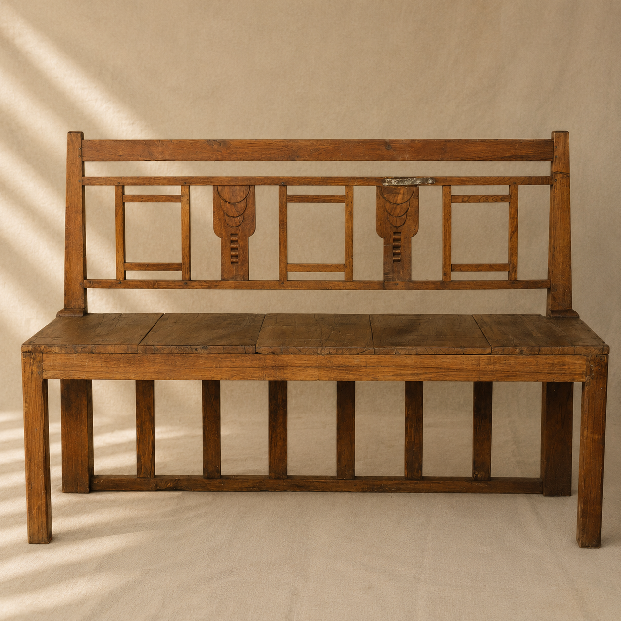 One-of-a-kind vintage Indian wooden bench with square geometric back, carved detailing and beautifully aged timber, exclusive to Brookfield Gardens.
