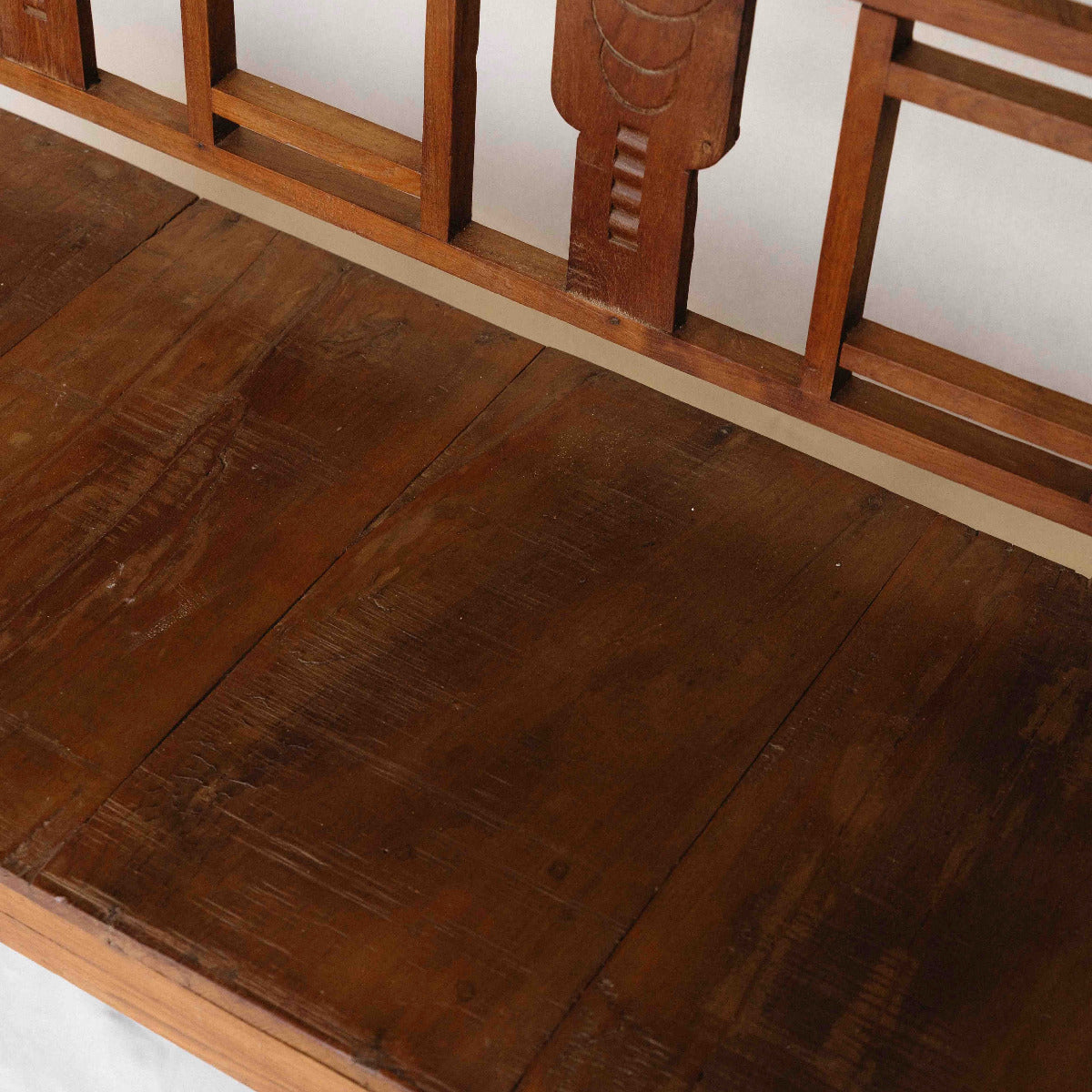 One-of-a-kind vintage Indian wooden bench with square geometric back, carved detailing and beautifully aged timber, exclusive to Brookfield Gardens.