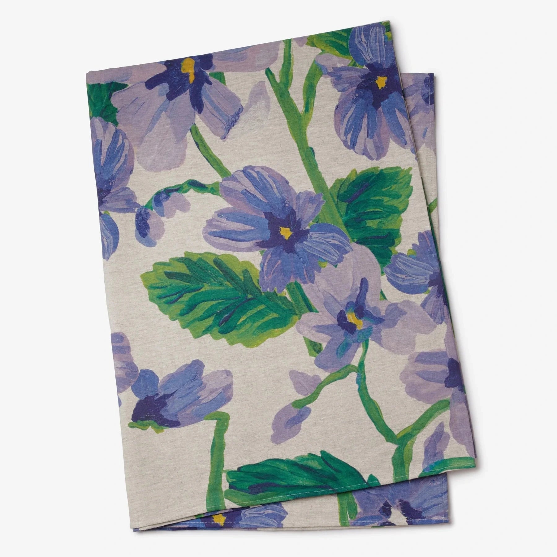 Floral-patterned fabric with purple and green flowers on a beige background