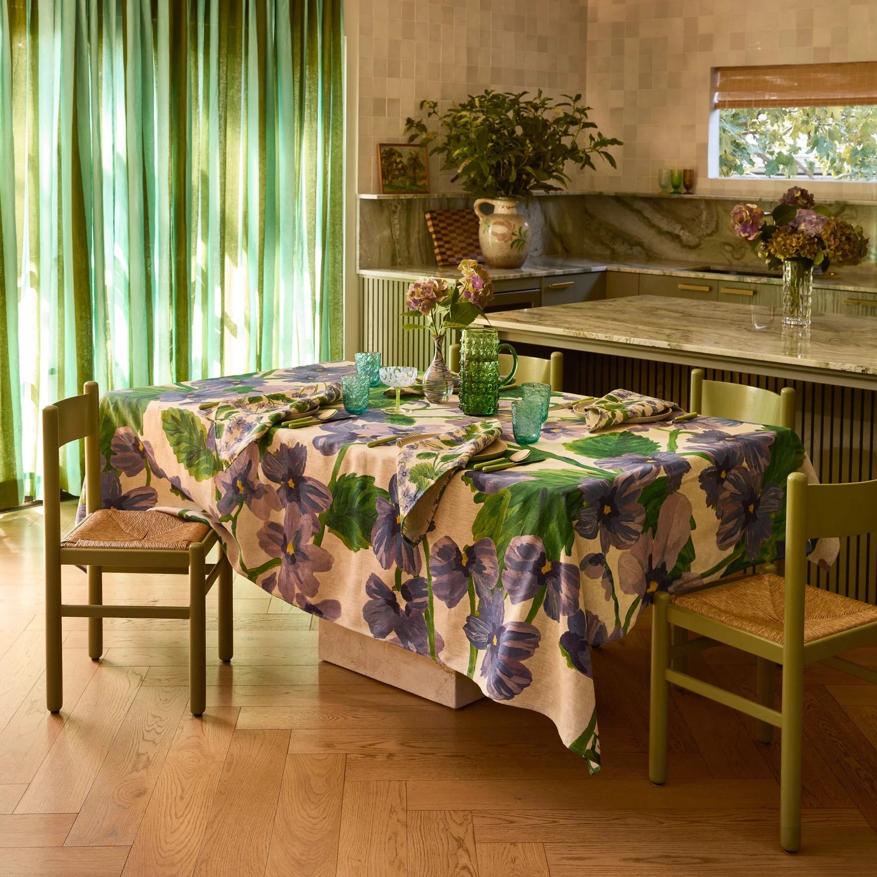 Bonnie and Neil Lilas Linen Tablecloth with soft lilac-blue florals and green foliage on oat linen.