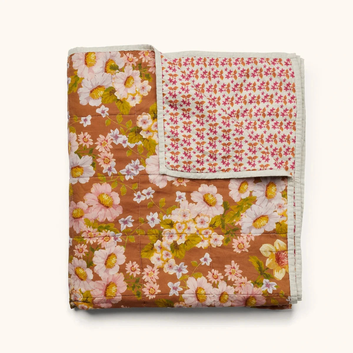 Bonnie & Neil Buttercup Rust & Petit Madeline Pink reversible linen quilted throw featuring warm rust florals and delicate pink botanical patterns.