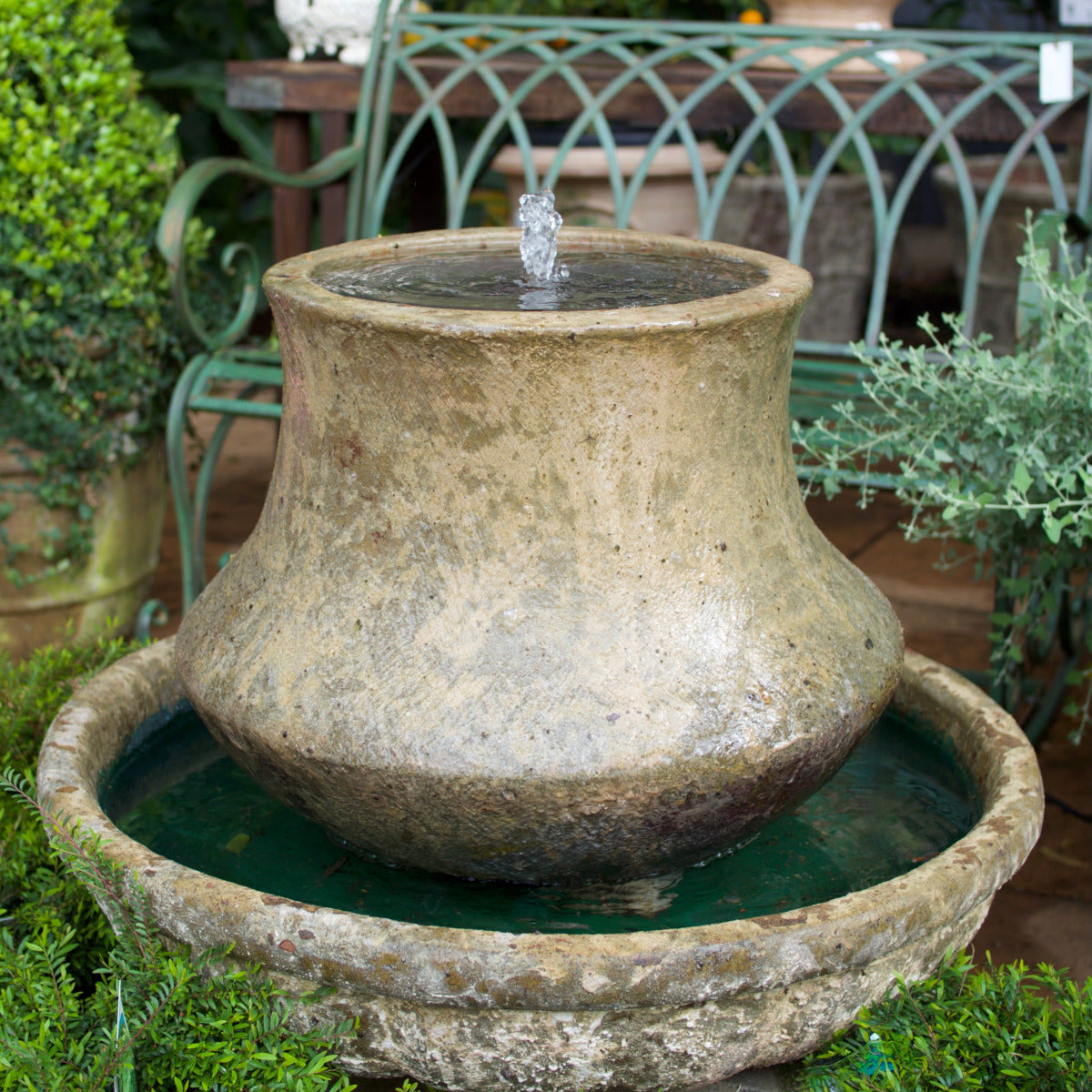 Tulip Fountain with Pump. Designed with a softly curved tulip-shaped form, this fountain creates a gentle bubbling water effect that adds movement and atmosphere to outdoor spaces.