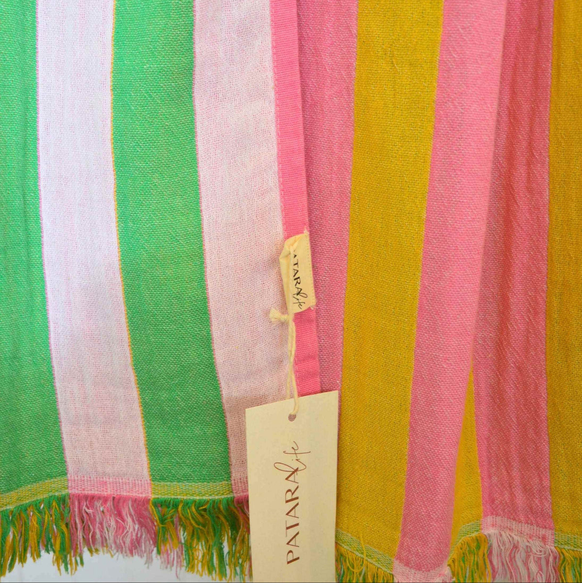 Patara Life Viva Stripe Turkish Beach Towel featuring colourful reversible stripes and fringed edges, made from 100% Turkish cotton.