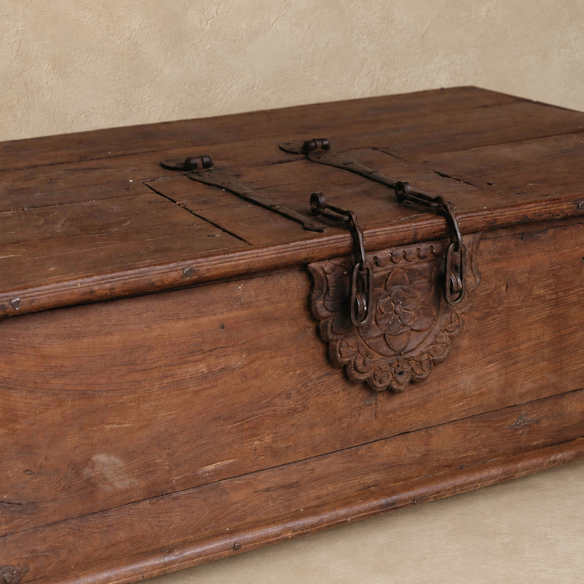 Vintage Indian wooden coffee table with lock, carved floral detail, iron hardware and hidden storage, exclusive to Brookfield Gardens Brisbane.