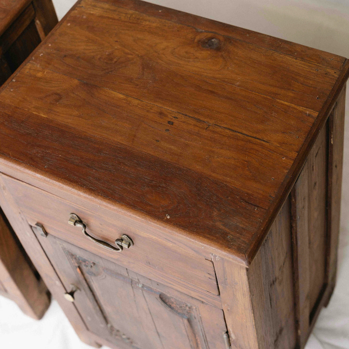Vintage wooden bedside table from India with one drawer, cupboard and carved timber door, sold separately, exclusive to Brookfield Gardens Brisbane.