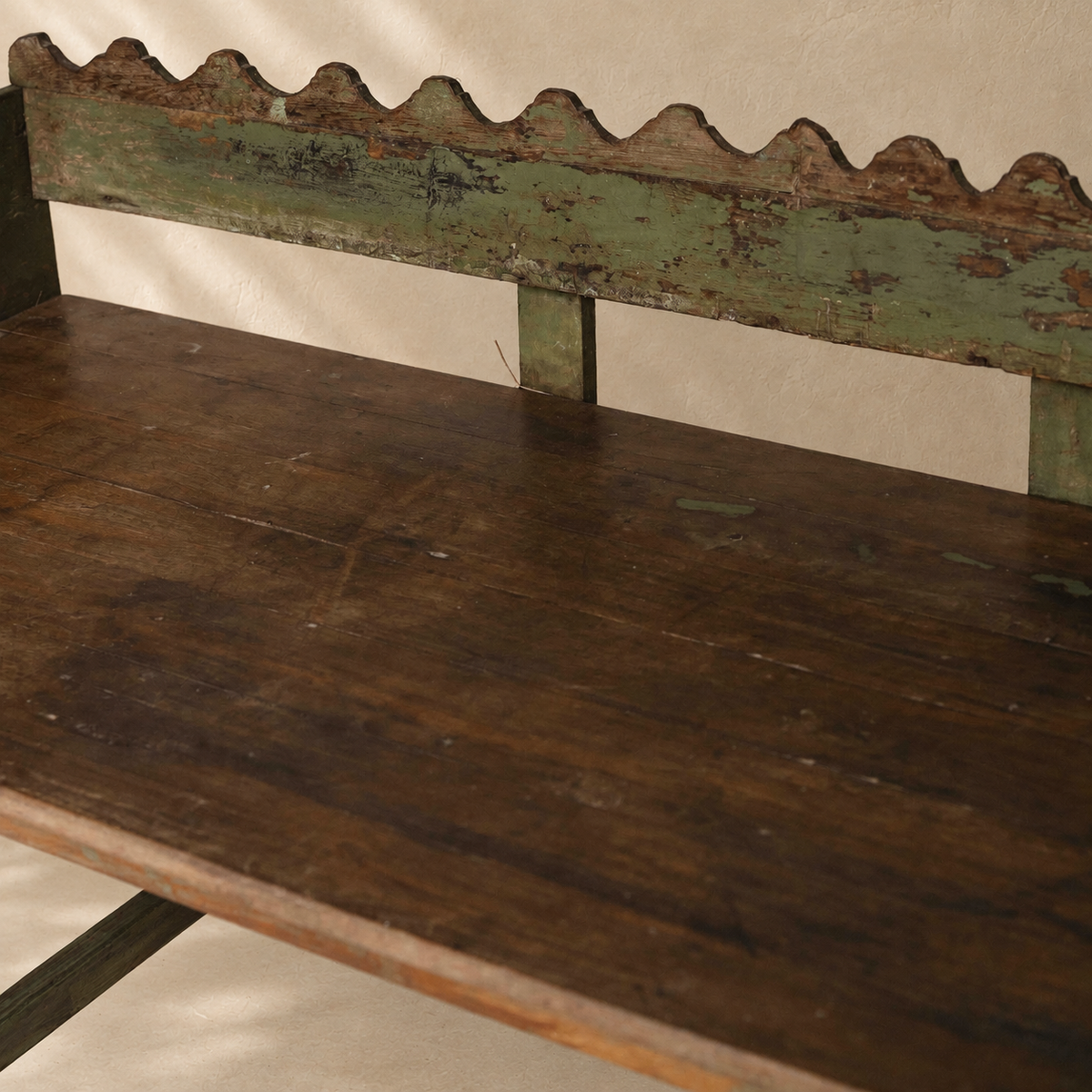 Vintage Indian wooden wave bench with scalloped back, original green paint and aged timber patina, exclusive to Brookfield Gardens.