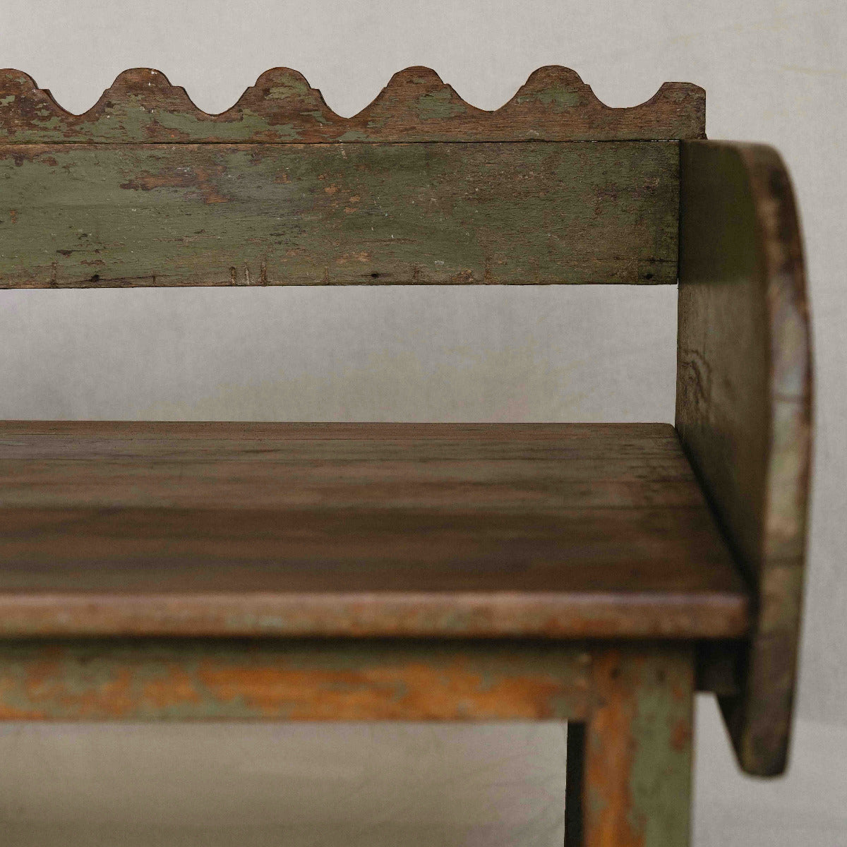 Vintage Indian wooden wave bench with scalloped back, original green paint and aged timber patina, exclusive to Brookfield Gardens.