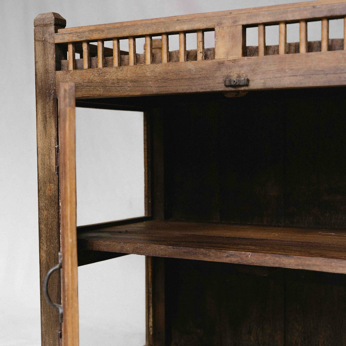 Vintage wooden glass cabinet from India with double doors and internal shelves, ideal for home storage and displaying ceramics and collected objects, exclusive to Brookfield Gardens.
