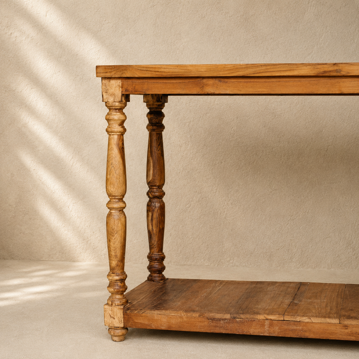 Indian wooden console table with turned legs, natural timber finish and full-length lower shelf.