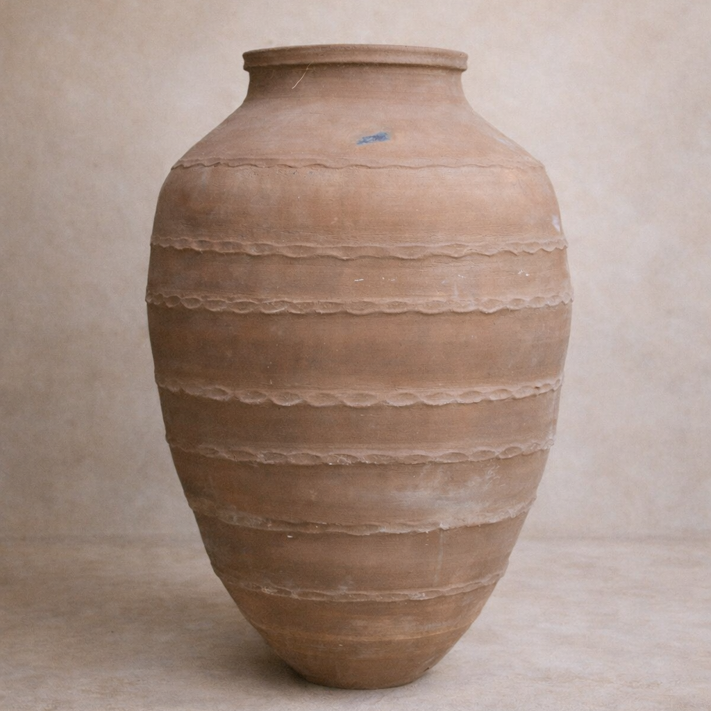 Ancient Turkish Odemis terracotta pot with horizontal banded detailing styled against limewash wall at Brookfield Gardens Brisbane