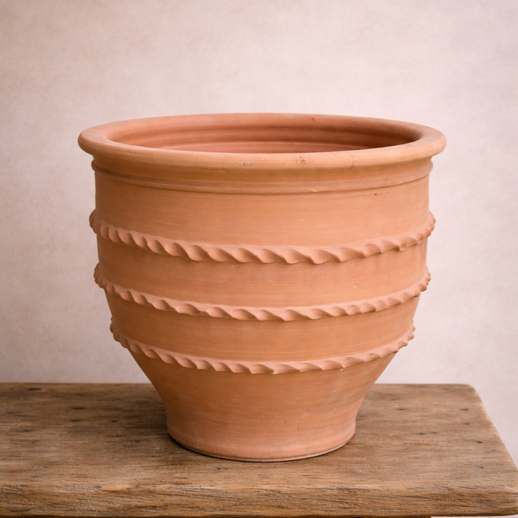 Hand-crafted Turkish terracotta open mouth pot with decorative rope detailing, shown on a timber surface.