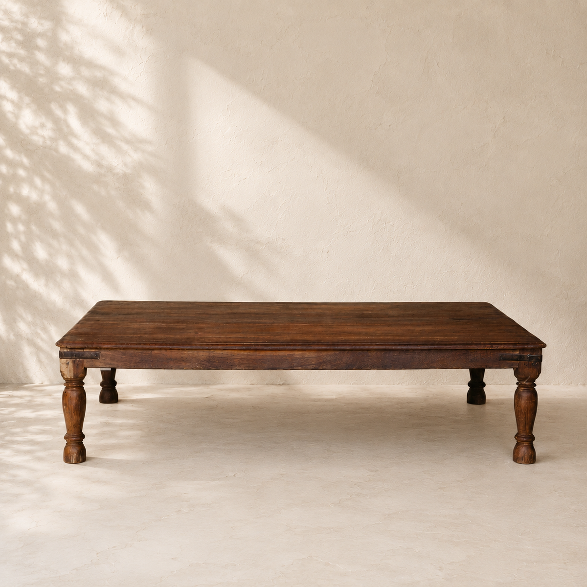 India Furniture wooden coffee table with aged timber finish and turned legs at Brookfield Gardens