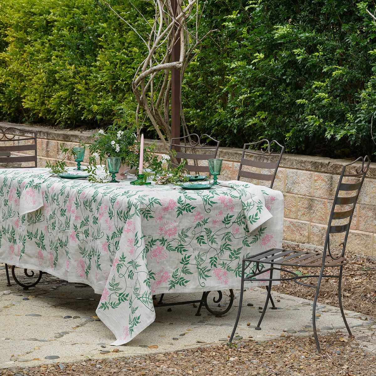 Aqua Door Designs Jasmine linen tablecloth featuring hand screen printed green and pink botanical vines on natural linen, available at Brookfield Gardens Brisbane.