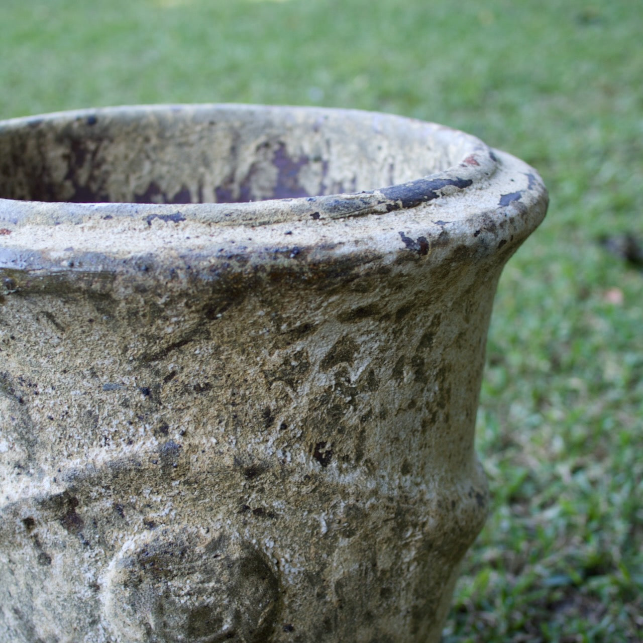 Rustica Anduze urns in two sizes with a weathered antique finish, displayed as elegant French-inspired feature pots at Brookfield Gardens, Brisbane.