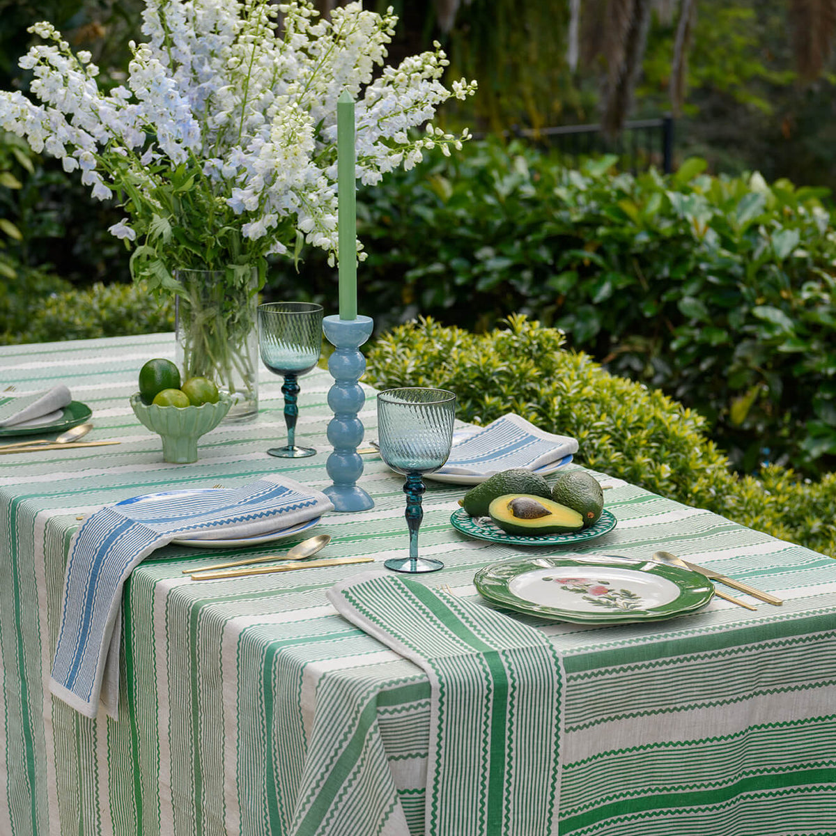 Aqua Door Designs Green Tuxedo Stripe linen tablecloth featuring glass green, grass green and bayleaf green stripes on natural linen.