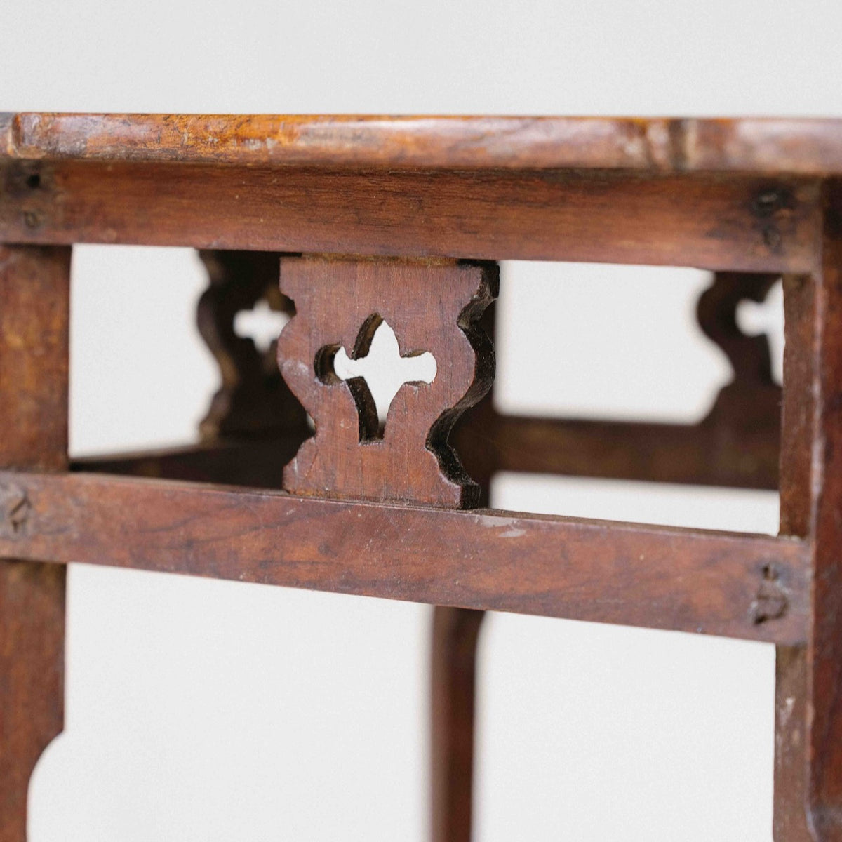 Vintage Indian small wooden side table with decorative cut-out details, ideal for orchids and home display, exclusive to Brookfield Gardens.