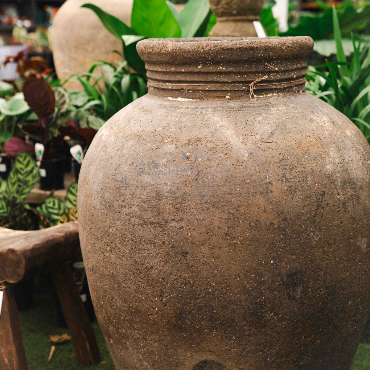 Large vintage Indian terracotta urn with rim neck and aged earthy patina.