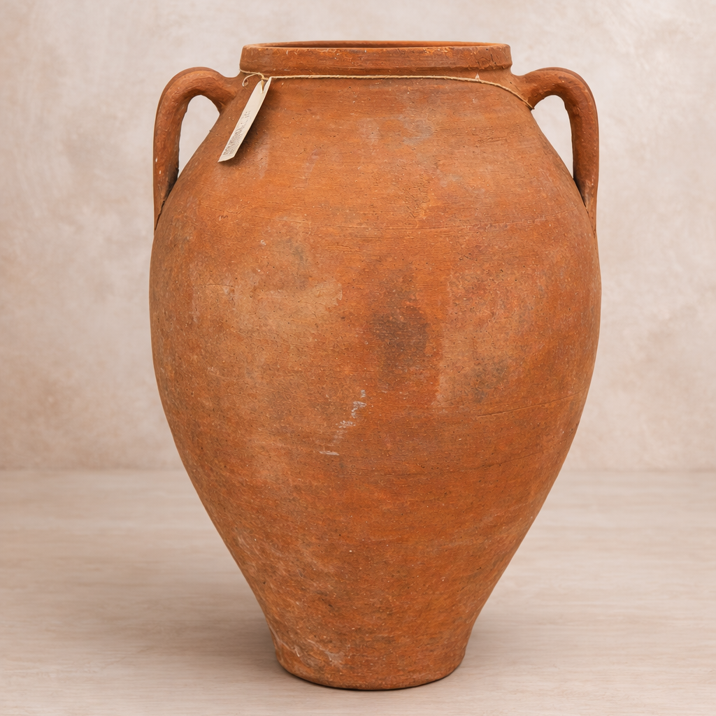 Ancient Turkish Odemis terracotta amphora pot with aged natural patina and side handles.