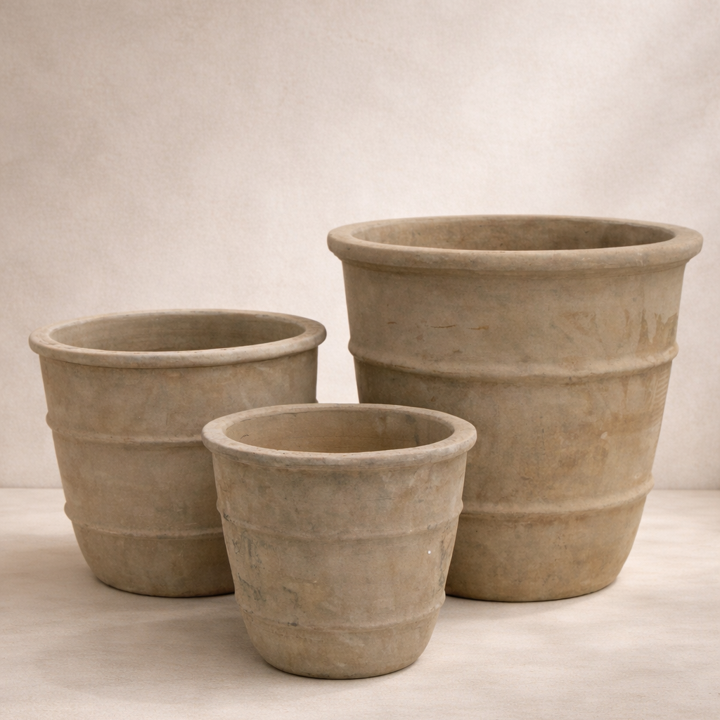 Three terracotta pots of different sizes on a neutral background brisbane garden formal