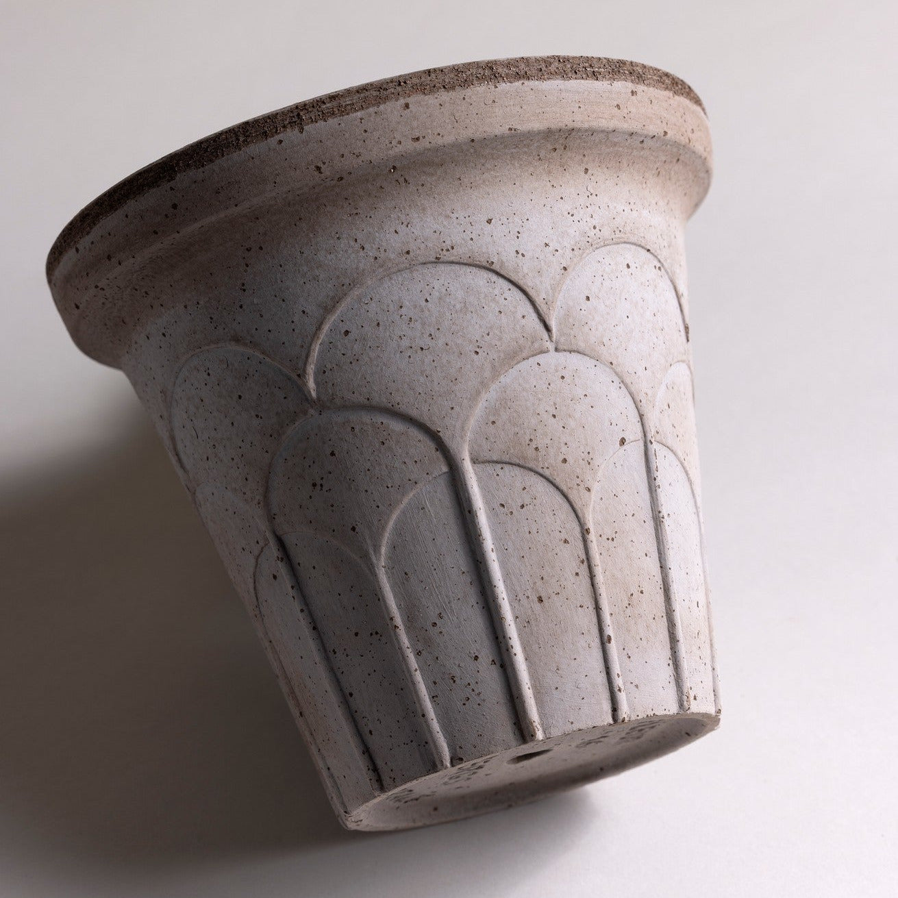 Bergs Potter Fleur grey terracotta pot with embossed floral relief and matching saucer