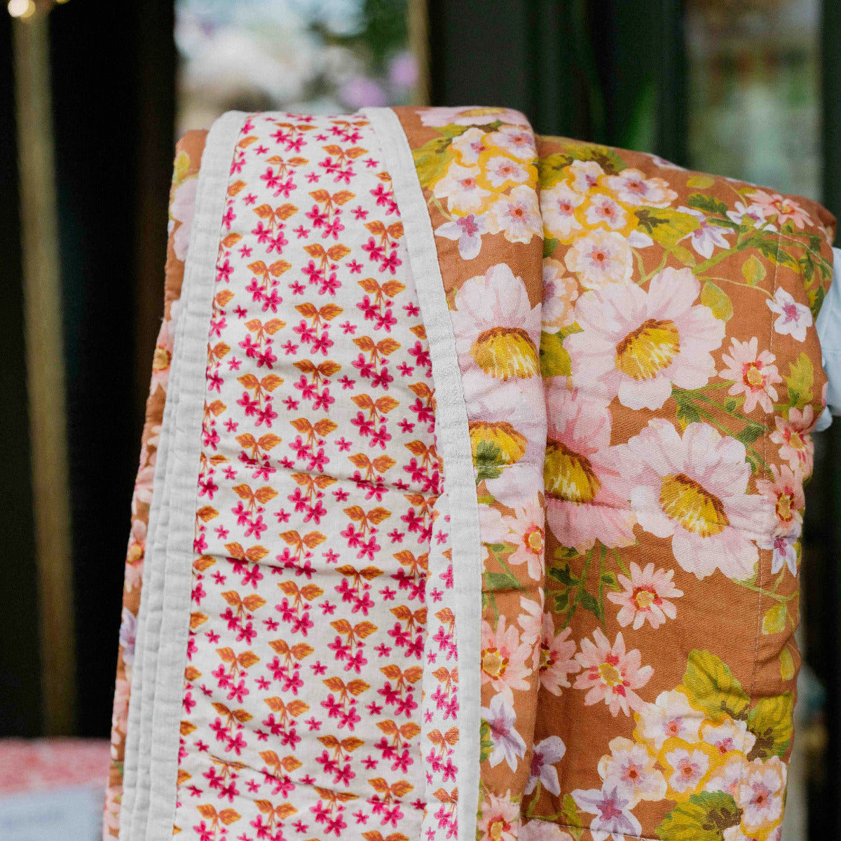 Bonnie & Neil Buttercup Rust & Petit Madeline Pink reversible linen quilted throw featuring warm rust florals and delicate pink botanical patterns.
