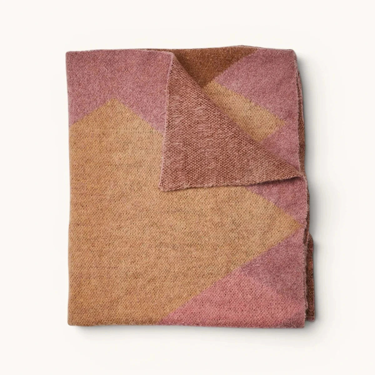 Wrap yourself in understated luxury with the Bonnie and Neil Geometric Pink Mohair Throw. Featuring a soft mohair blend and modern colour-block design, it's the perfect finishing touch for beds, sofas and cosy living spaces.