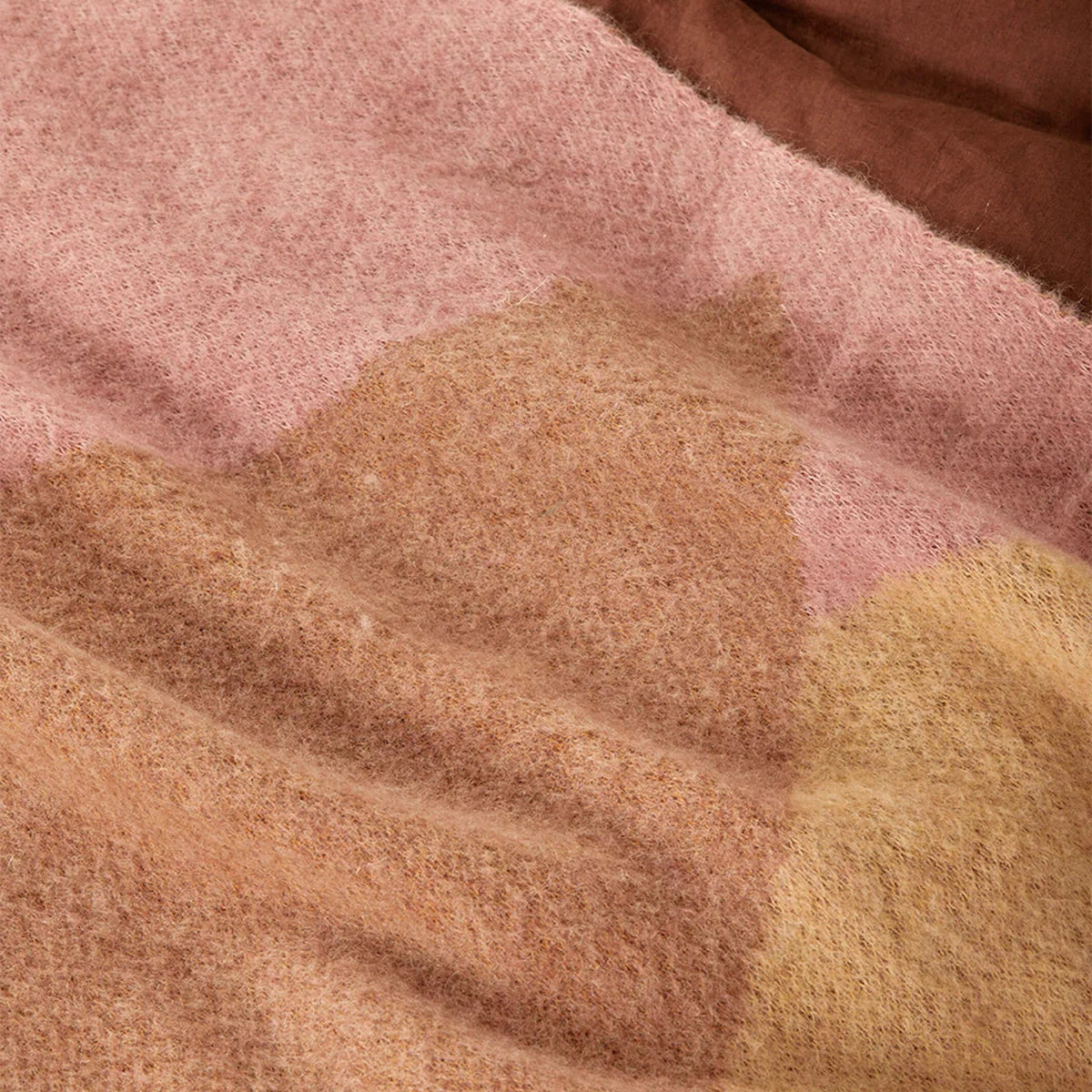 Wrap yourself in understated luxury with the Bonnie and Neil Geometric Pink Mohair Throw. Featuring a soft mohair blend and modern colour-block design, it's the perfect finishing touch for beds, sofas and cosy living spaces.