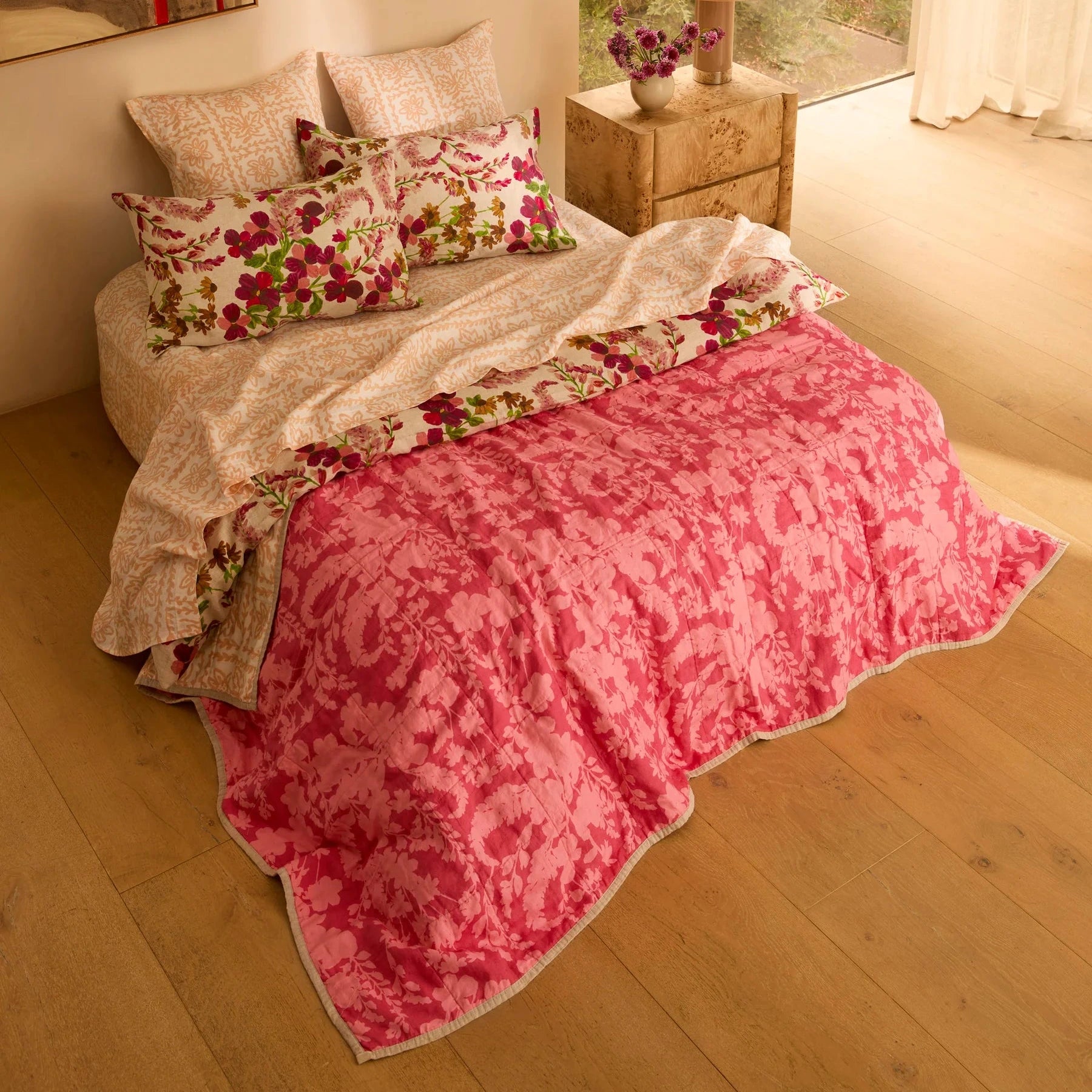 Bonnie and Neil Petal Pink & Daisy Buff linen quilted throw with reversible floral prints in soft pink and warm buff tones, crafted from stonewashed French flax linen.