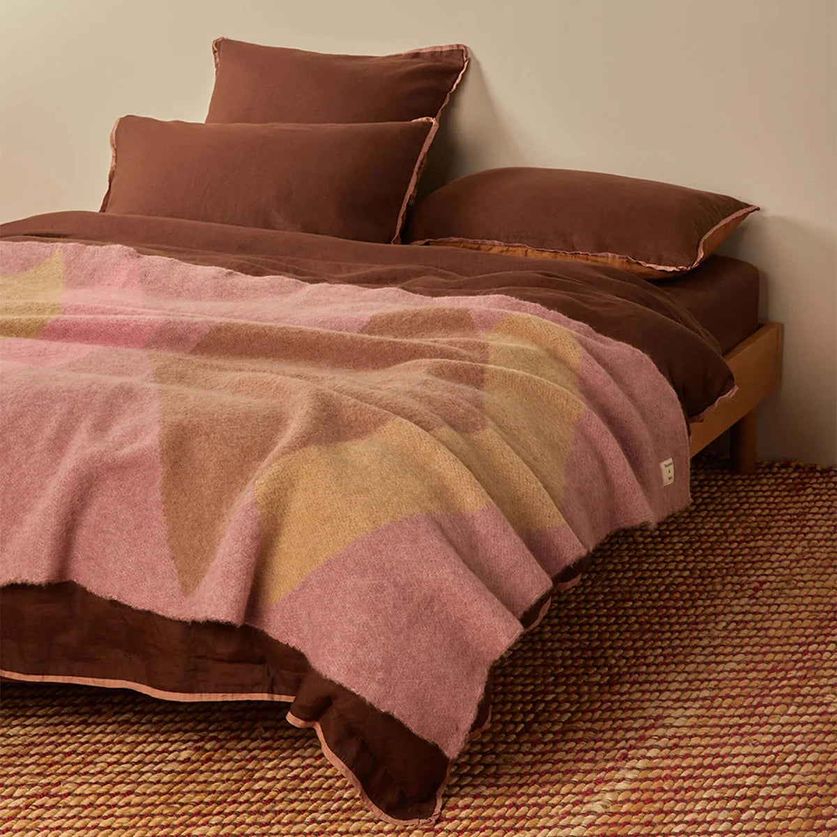 Wrap yourself in understated luxury with the Bonnie and Neil Geometric Pink Mohair Throw. Featuring a soft mohair blend and modern colour-block design, it's the perfect finishing touch for beds, sofas and cosy living spaces.