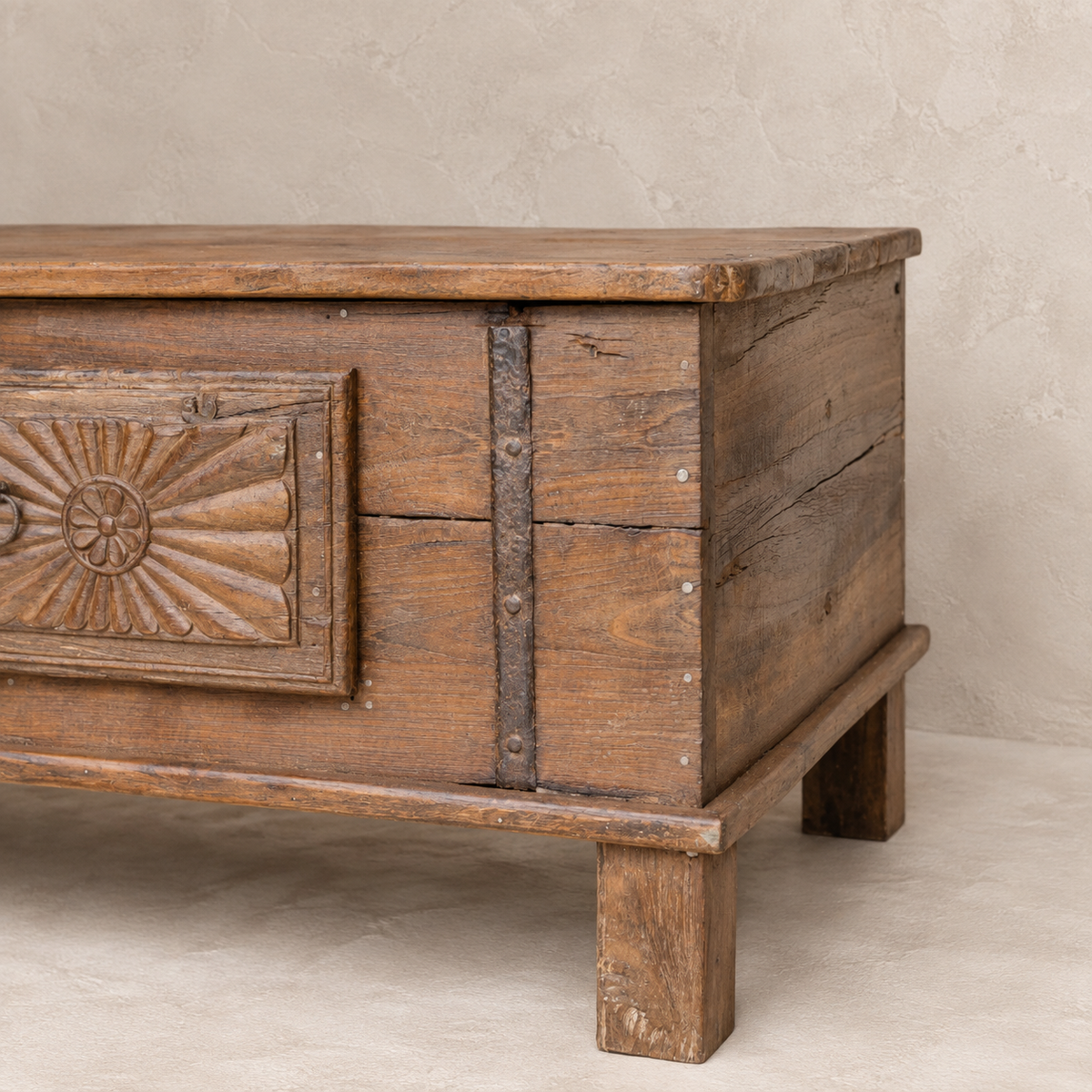 Vintage carved wooden coffee table from India with floral sunburst detailing and aged timber, 106 × 57 × 45cm, exclusive to Brookfield Gardens.