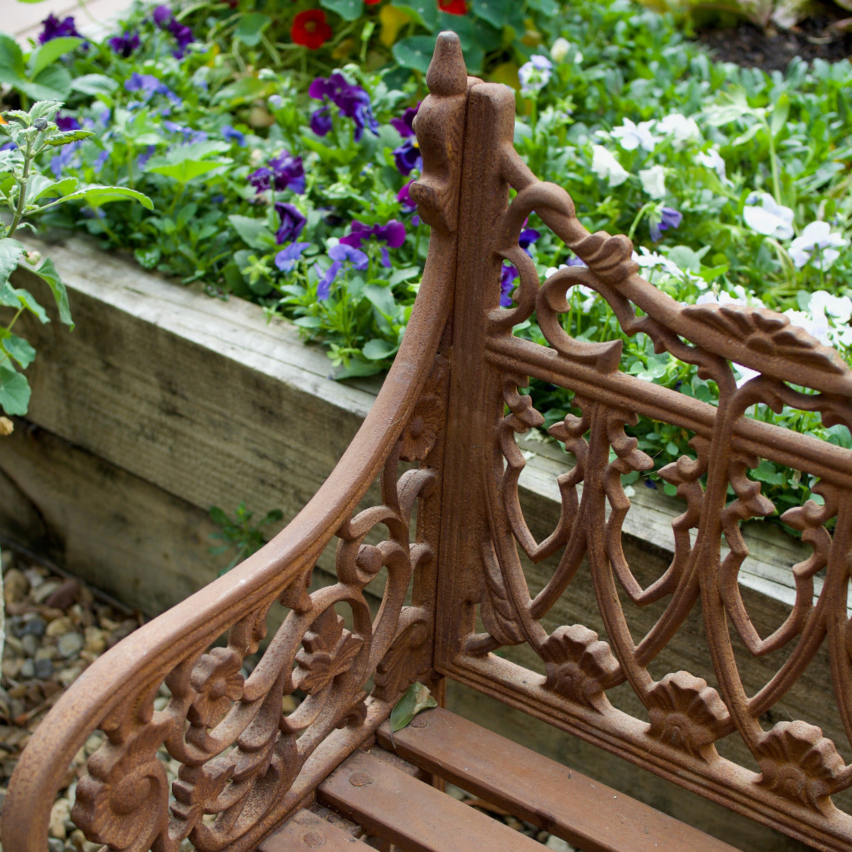 Rust natural ornate Shelly garden bench with decorative detailing