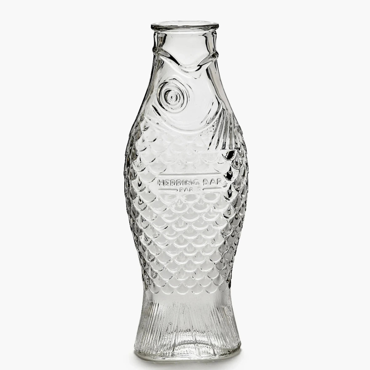 Clear glass bottle with fish-scale pattern on a white background