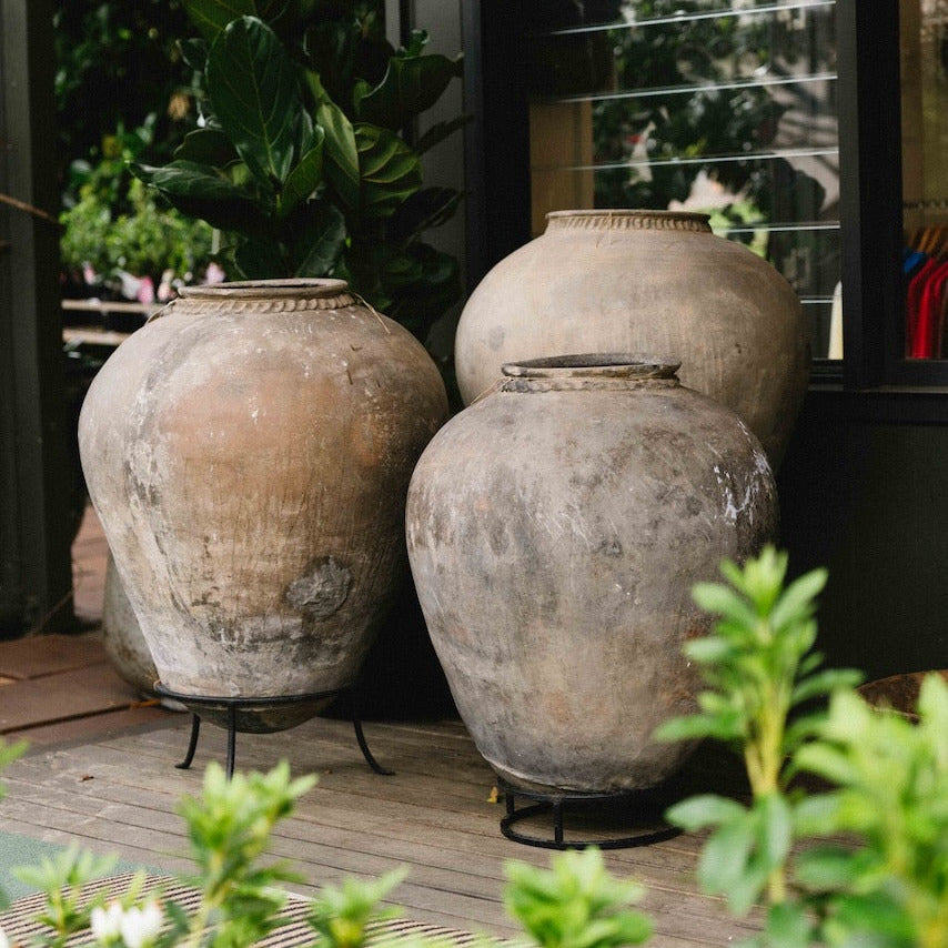 Large vintage Indian terracotta urn with rounded form, decorative rim and naturally weathered earthy finish, exclusive to Brookfield Gardens.