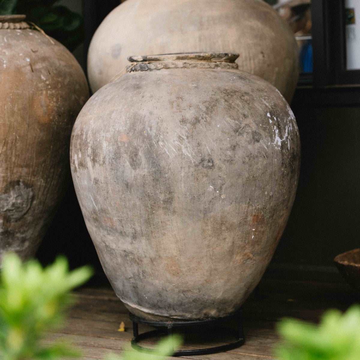 Large vintage Indian terracotta urn with rounded form, decorative rim and naturally weathered earthy finish, exclusive to Brookfield Gardens.