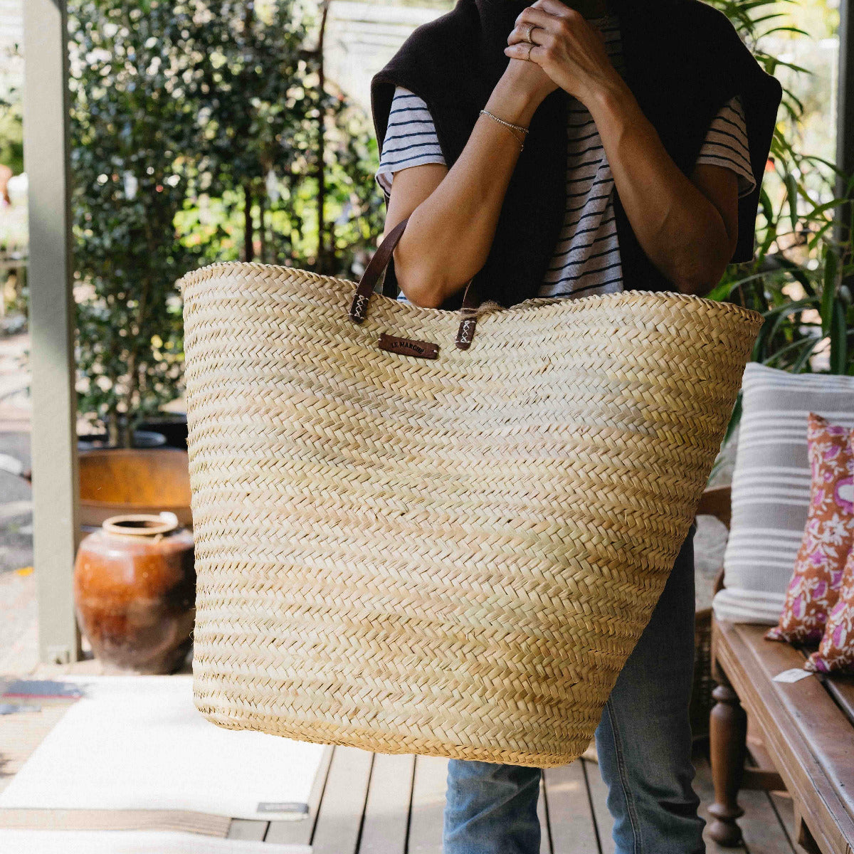 Oversized Le Marché Basket handmade in Morocco from premium palm leaf with genuine leather handles, available at Brookfield Gardens Brisbane.