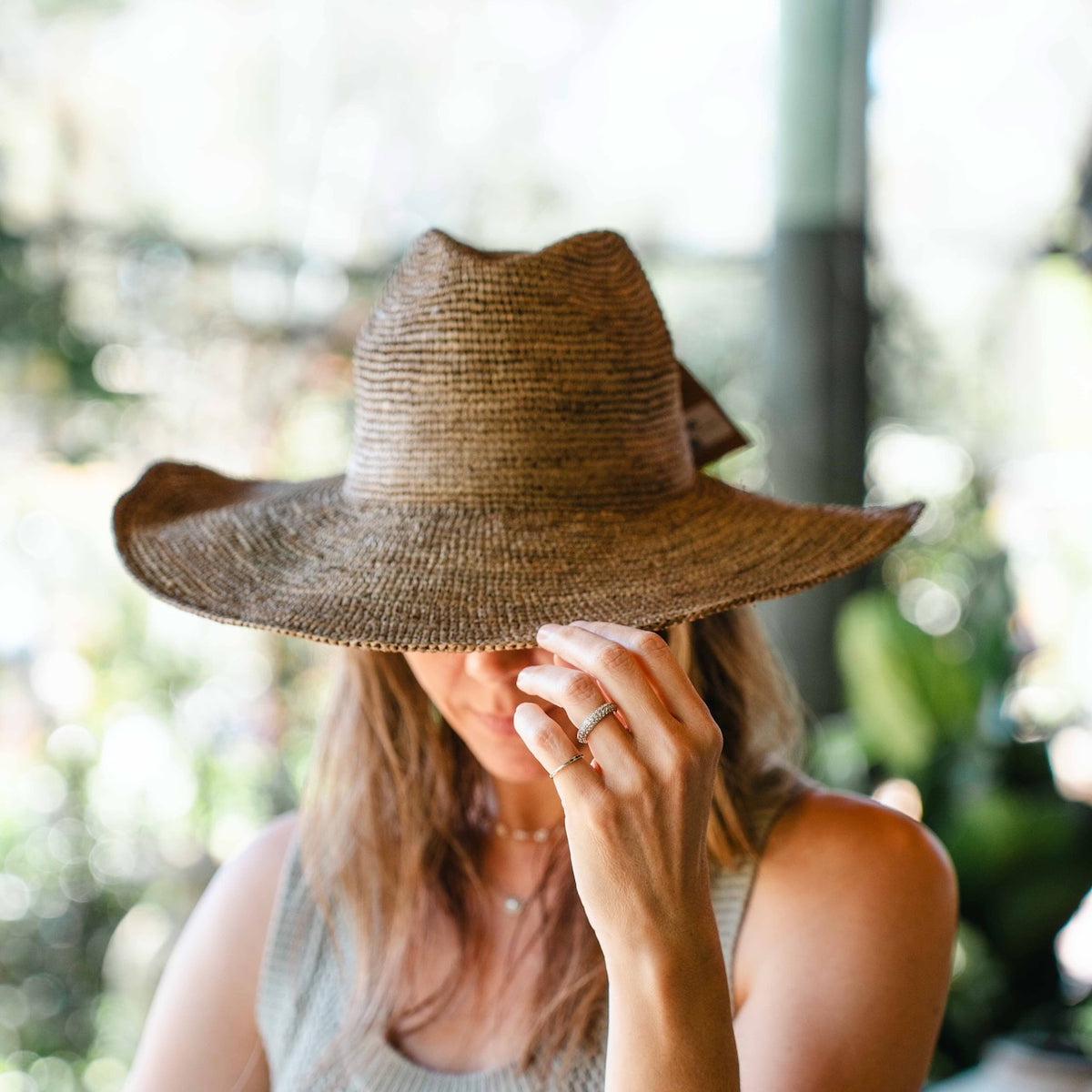 Made in Mada Aziz Lace gardening hat, handwoven from natural raffia with delicate lace-style detailing and a wide brim, available at Brookfield Gardens.
