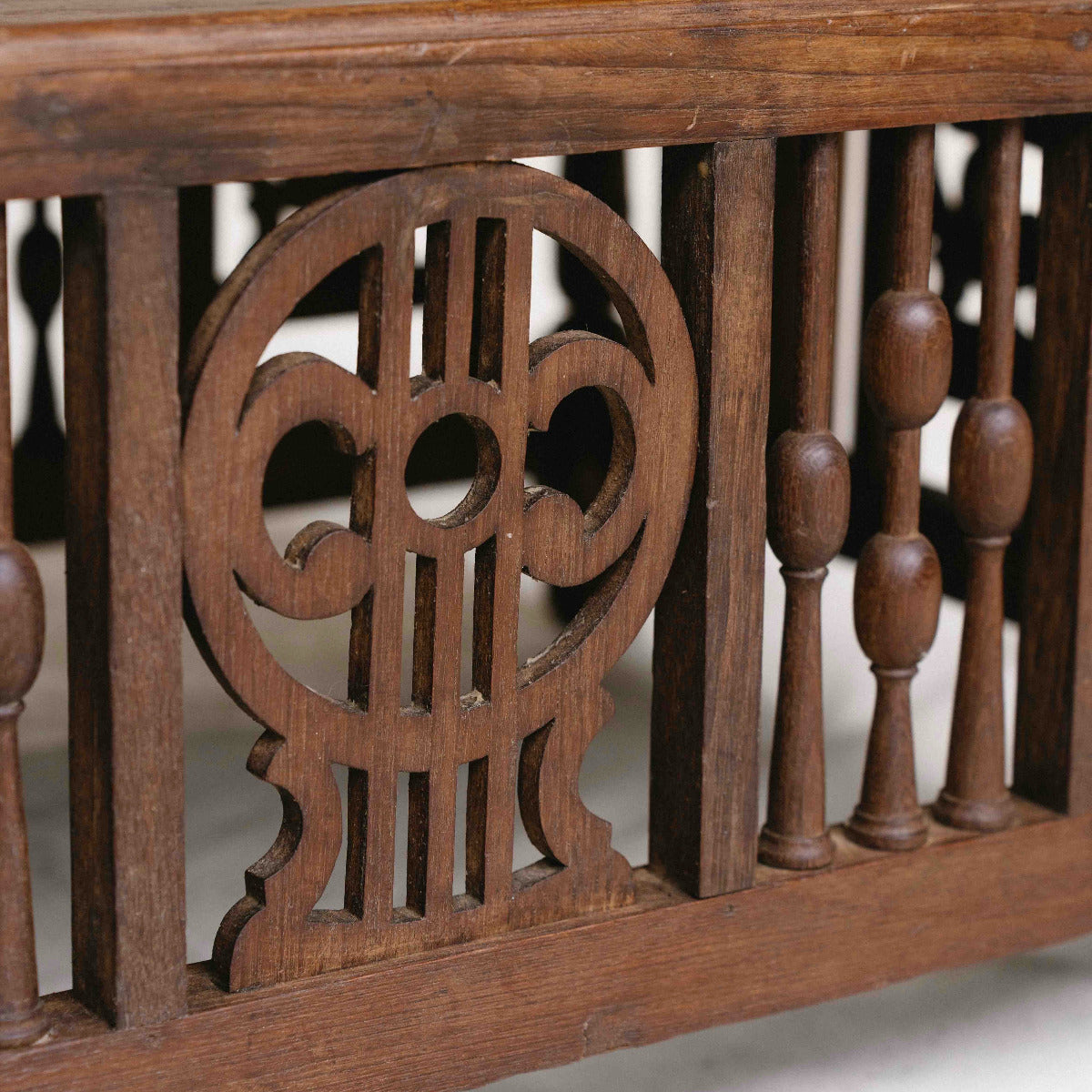 Vintage ornate wooden coffee table from India, 85 x 56 x 43cm, with carved panels, turned details and aged timber, exclusive to Brookfield Gardens Brisbane.