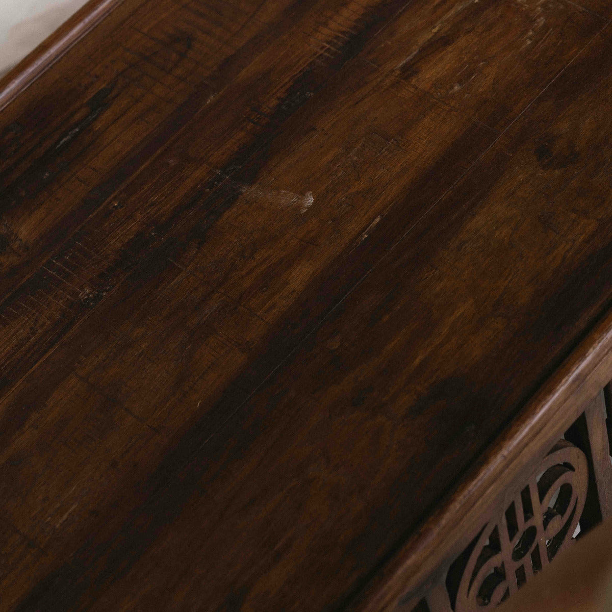 Vintage ornate wooden coffee table from India, 85 x 56 x 43cm, with carved panels, turned details and aged timber, exclusive to Brookfield Gardens Brisbane.