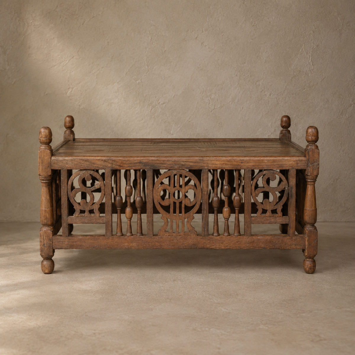 Vintage ornate wooden coffee table from India, 85 x 56 x 43cm, with carved panels, turned details and aged timber, exclusive to Brookfield Gardens Brisbane.