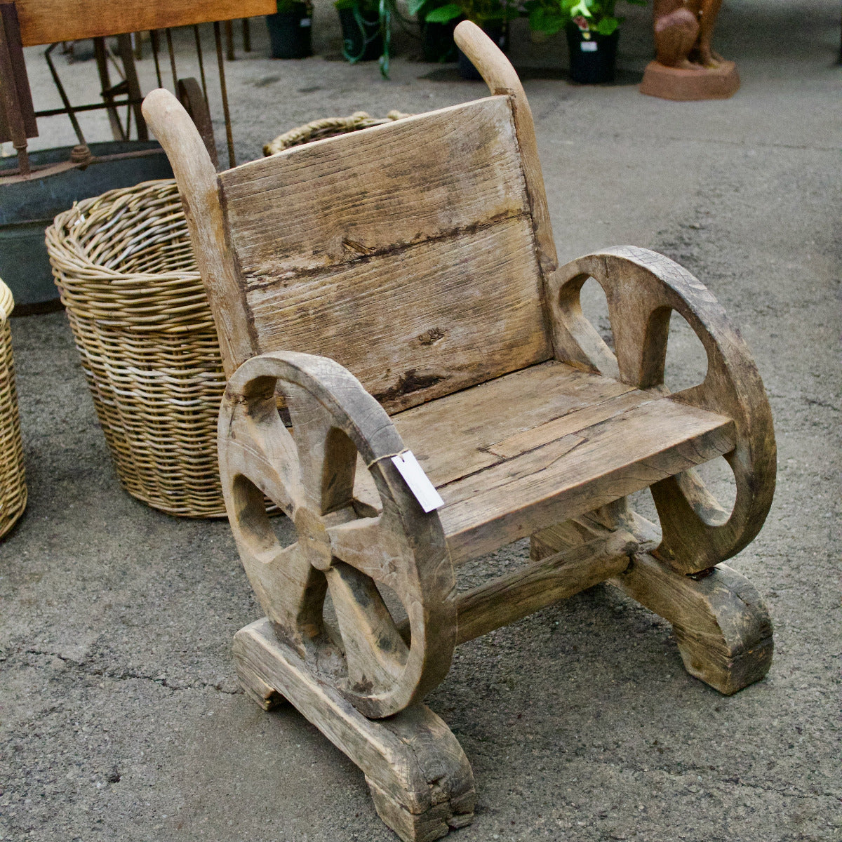 Wooden bench with wheels on a concrete surface