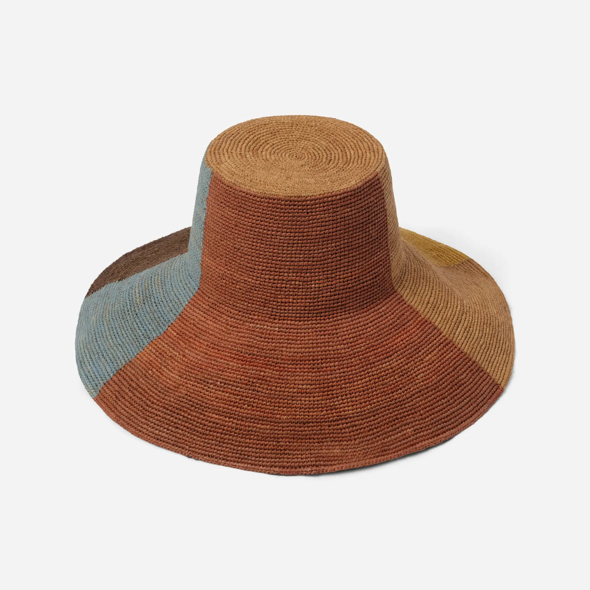 Tanora Rahel Sun handwoven raffia hat with terracotta sunburst design, natural earthy tones and wide wired brim, available at Brookfield Gardens.