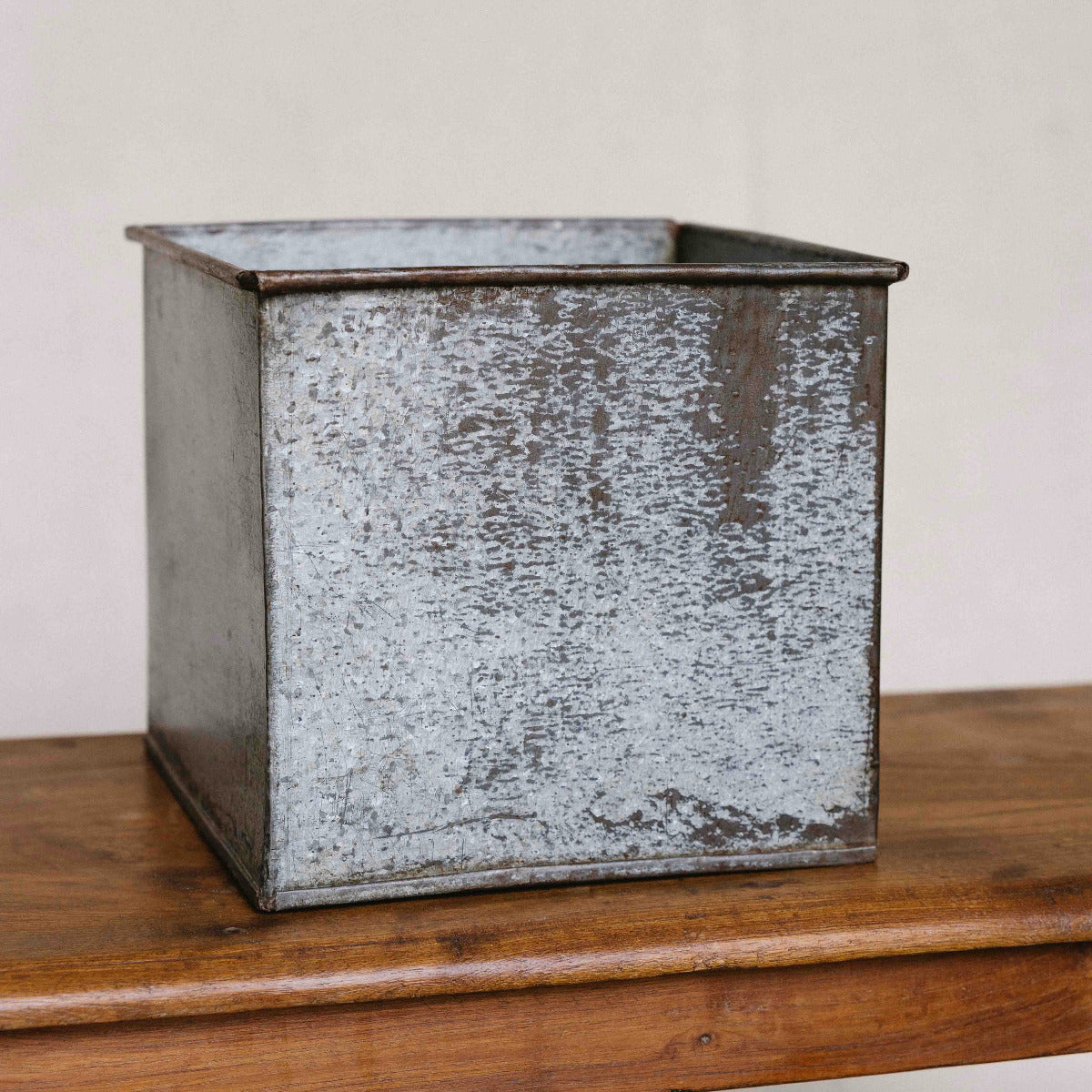 Square iron planter with naturally aged galvanised metal finish, 24 x 24 x 21cm, available at Brookfield Gardens Brisbane.