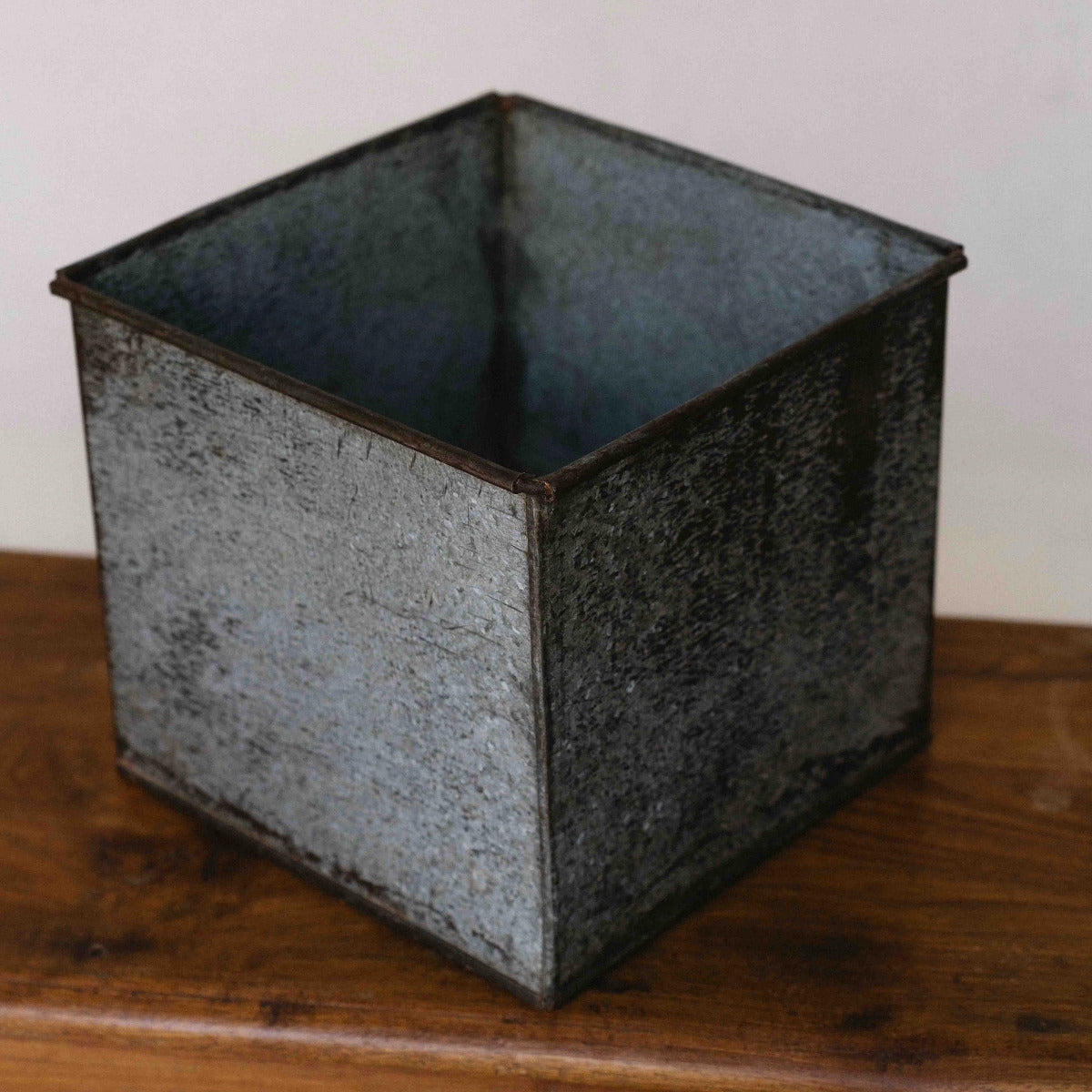 Square iron planter with naturally aged galvanised metal finish, 24 x 24 x 21cm, available at Brookfield Gardens Brisbane.
